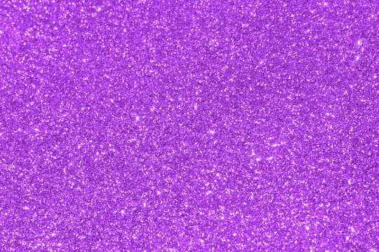 Purple glitter texture background.  New Year, Christmas and all celebration background concepts. 