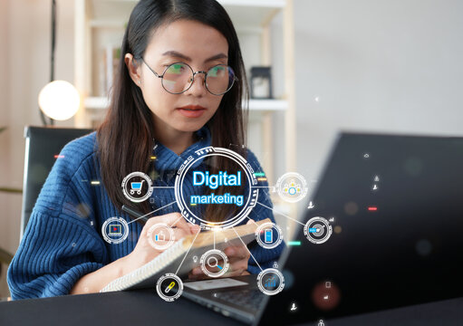 Asian woman researching development plans for targeted digital marketing. Online business advertising, content creation strategy Choosing target audience on website platform increases customer traffic - Powered by Adobe