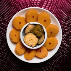 Top view of a white plate with two items
 of food served on it