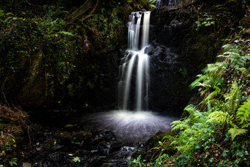 Fototapeta na wymiar Beautiful hidden waterfall in Connemara National park in summer