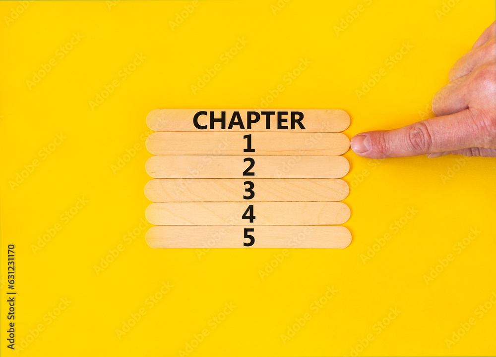 Wall mural Time to chapter 1 symbol. Concept word Chapter 1 2 3 4 5 on wooden sticks. Businessman hand. Beautiful yellow table yellow background. Business planning and time to chapter 1 concept. Copy space.