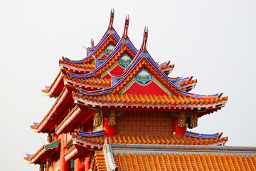 Fototapeta premium Details of Fantastic Colorful Ornate Roofs of a Chinese Buddhist Temple