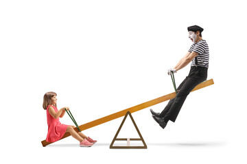 Mime playing with a girl on a seesaw