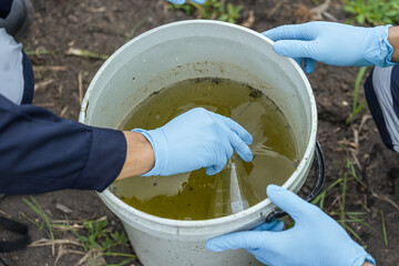 Environmental researchers investigate the condition of canal water for toxic spills, river waste...