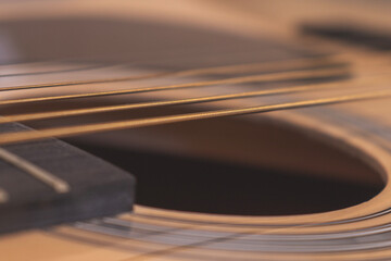 Close-up of an acoustic guitar's chords. Copy space.
