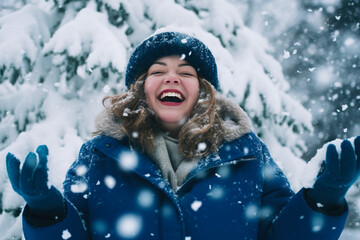 Beautiful overweight woman enjoying winter snowflakes in a joyful outdoor moment. 
