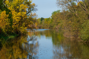 Fototapeta na wymiar Beautiful Tree Colors Along The River In Fall