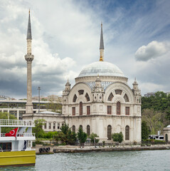 Fototapeta na wymiar View from Bosphorus strait overlooking Baroque style Dolmabahce Mosque, located at the waterside of Kabatas, in Beyoglu district, Istanbul, Turkey