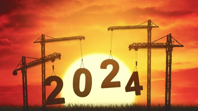 Silhouette of cranes dropping number 2024 on grass with a huge sun rising
