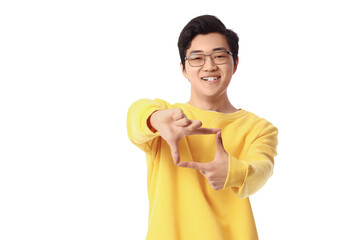 Young Asian man making frame with his hands on white background