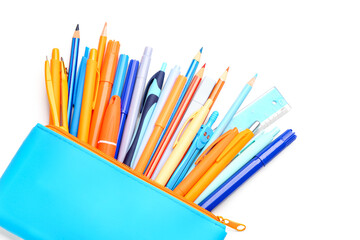 Fototapeta premium Blue pencil case with different stationery on white background