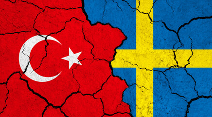 Flags of Turkey and Sweden on cracked surface - politics, relationship concept