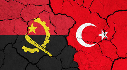 Flags of Angola and Turkey on cracked surface - politics, relationship concept
