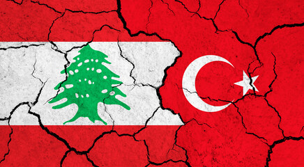 Flags of Lebanon and Turkey on cracked surface - politics, relationship concept