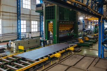 Pipe factory production line. Tube formation by roll sheet bending machine