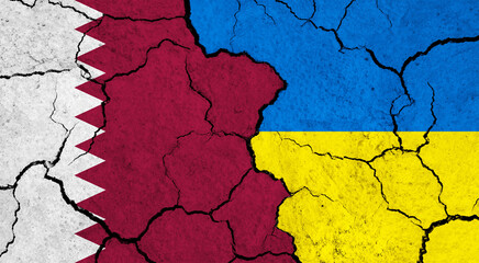 Flags of Qatar and Ukraine on cracked surface - politics, relationship concept