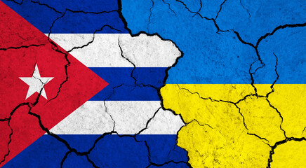 Flags of Cuba and Ukraine on cracked surface - politics, relationship concept