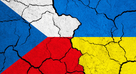 Flags of Czech Republic and Ukraine on cracked surface - politics, relationship concept