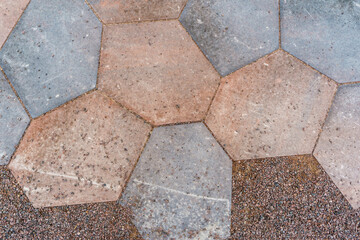 A colourful and modern hexagonal yard tile.