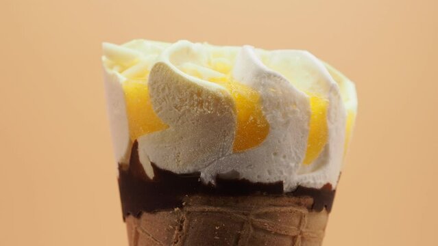 Lemon ice cream waffle cups. Ice cream on an orange background.