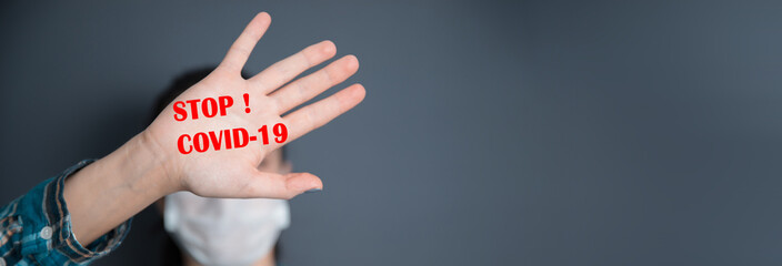 woman hand stop sign with covid