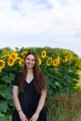 farming and agronomy in ukraine.sunflower promotion.yellow field.young harvest.sunflowers wallpaper.girl smells flowers.sunflower oil production.
woman with sunflowers.enjoying nature.girl in flowers.