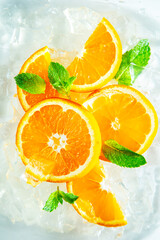 Fresh juicy orange slices with mint and ice.