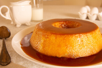 Creme Caramel Condensed Milk Pudim with melting caramel topping in front view