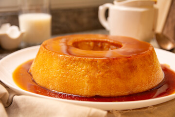 Creme Caramel Condensed Milk Pudim with melting caramel topping in front view