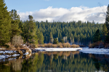 Snowy bank of the Upper Deschutes River in Winter, Bend Oregon 