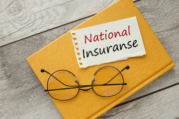 National Insurance torn paper with text. yellow notepad