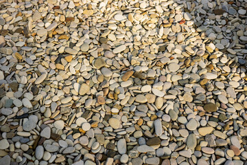 Small stones bacground in sunny day