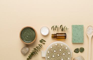 Composition with cosmetic clay and spa products on color background, top view