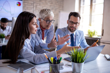 Three business professionals working together