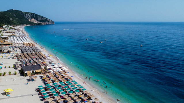 Aerial view of Dhermi, Albania 2023. Beautiful colorful Coastline of Ionian Sea. Popular beach for tourism.