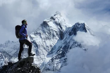 Fototapete Ama Dablam Man on peak of mountain. View of Ama Dablam on the way to Everest Base Camp, Nepal