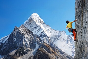 Climber reaches the summit of mountain peak. Active sport concept. - 631306760