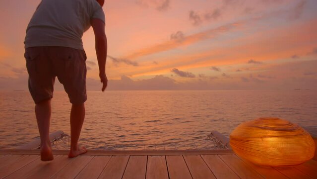 Man enjoys sunset in luxury villa
