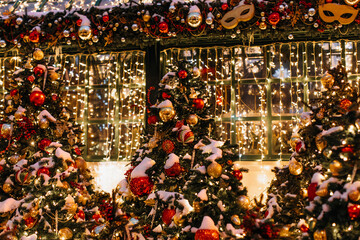 Christmas trees with red golden Christmas balls and shiny garlan