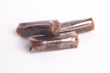 The little brown book named is a traditional snack on a white background