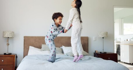 Happy, energy and jump with children in bedroom for morning, wake up and holding hands. Dance, happiness and fun with excited kids on bed in family home for celebration, freedom and support together - Powered by Adobe