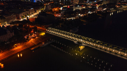 Bird's eye view taken from a drone at night - panoramic view of a night city in a European city, Bratislava ( Slovakia ) with night traffic and streetlights