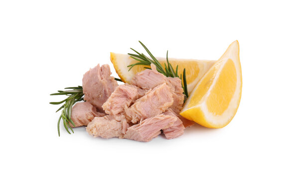 Delicious canned tuna chunks with lemon and rosemary isolated on white