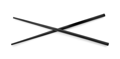 Pair of black chopsticks isolated on white, top view