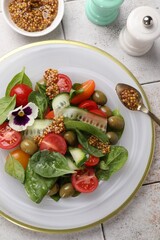 Delicious salad with vegetables, olives and grain mustard on light table, flat lay