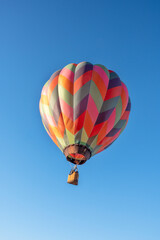 Flying balloons in the blue sky, Adirondack, Queensbury, New York. colorful hot air balloons and...