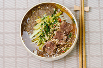 Yeolmunaengmyeon, korean style Buckwheat Noodles with YoungSummer Radish Kimchi, This dish features cold noodles in kimchi soup that is made by mixing salted young radish with chopped onion