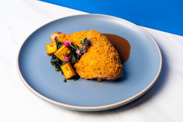 fried chicken thigh with vegetable and sauce