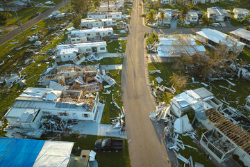 Destroyed by hurricane Ian suburban houses in Florida mobile home residential area. Consequences of...