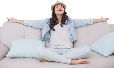 Digital png photo of caucasian woman sitting on sofa on transparent background